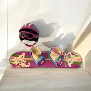 American Girl - Snowboard with attached bindings, boots, helmet and goggles.